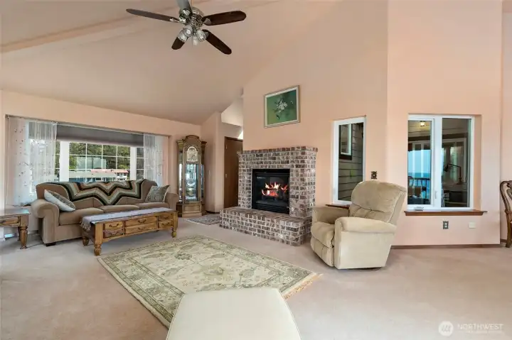 Windows to the right of the fireplace are through to the office atrium