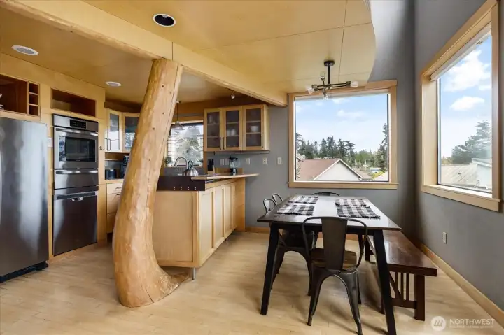 Sean Bell's use of salvaged Madrona Tree trunks is my favorite feature of the home.
