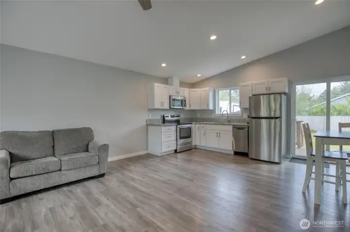 Stepping through the front door, you enter a large family room, kitchen and dining room.