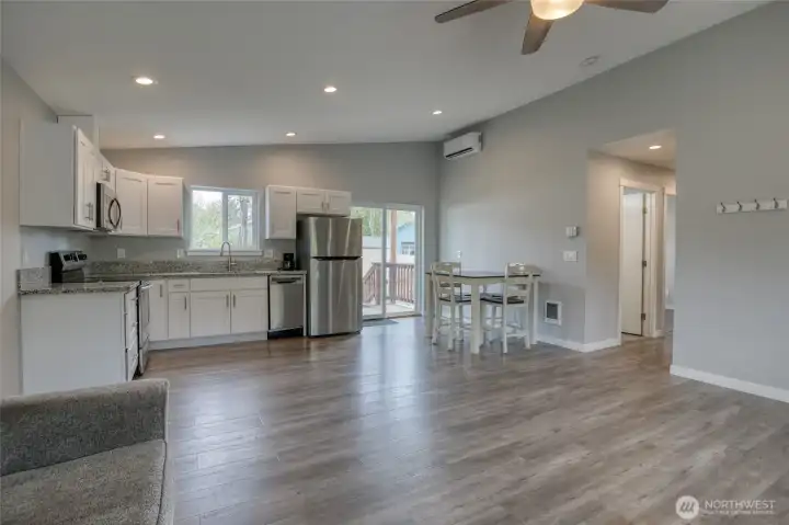 Dining table, chairs, TV and sofa stay. Granite counters, stainless steel appliances. Notice the mini-split to keep you warm in winter and cool in summer!