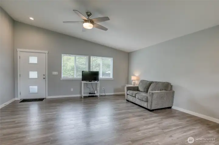 Looking from kitchen toward the front door and family living area.  Lots of room!