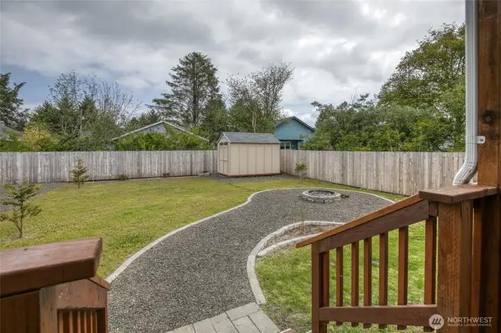 Step out your kitchen sliding door to your back deck and enjoy a yard that is already landscaped for you! With a garden shed and fire pit. You can hear the waves calling you!