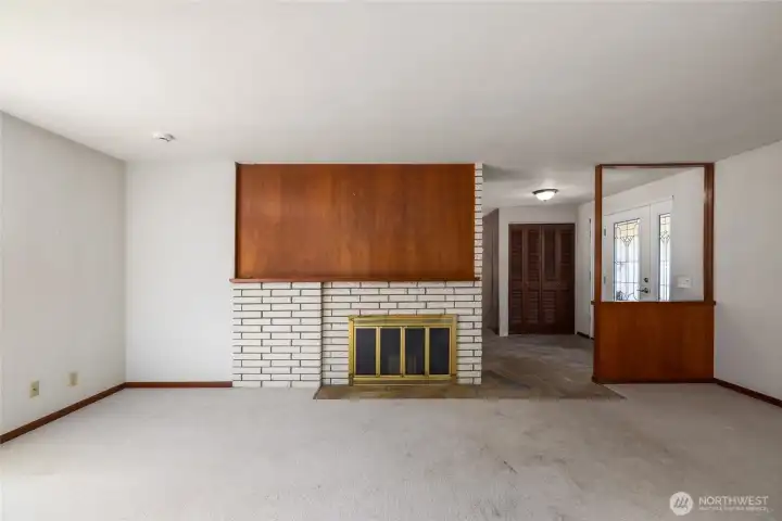 The dual-sided fireplace as seen from the living room, just on the other side of the wall from the dining room