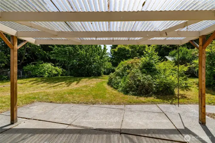 From the covered patio, looking out over the spacious and secluded back yard.