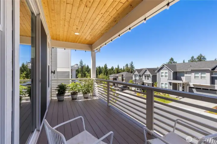 2025 fully custom composite deck features a natural wood tongue-and-groove ceiling, integrated lighting, and a custom built-in sun and privacy shade. 2025 fully custom composite deck features a natural wood tongue-and-groove ceiling, integrated lighting, and a custom built-in sun and privacy shade.