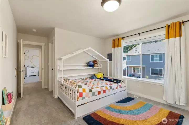 Alternative view of the bedroom highlights a spacious layout, crisp white trim, neutral designer paint, and high-quality low-pile carpet. Alternative view of the bedroom highlights a spacious layout, crisp white trim, neutral designer paint, and high-quality low-pile carpet.