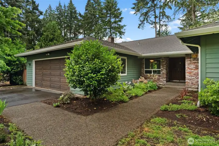 A beautifully crafted stone pathway guides you from the spacious driveway straight to the front door A beautifully crafted stone pathway guides you from the spacious driveway straight to the front door