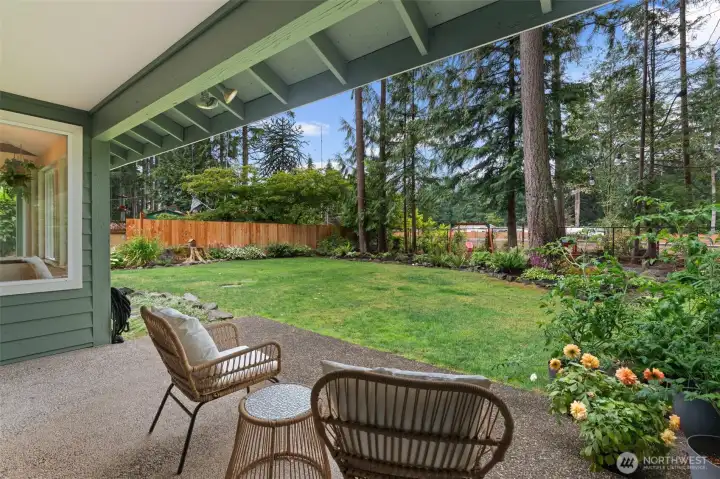 True Pacific Northwest outdoor living! The spacious covered patio allows for year-round entertaining and relaxation, looking out over a beautifully manicured, expansive backyard lawn! True Pacific Northwest outdoor living! The spacious covered patio allows for year-round entertaining and relaxation, looking out over a beautifully manicured, expansive backyard lawn!