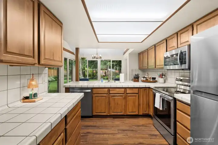 This stunning kitchen features a generous center island with breakfast bar seating, ample counter space, and a layout that keeps you perfectly connected to the dining and living areas. This stunning kitchen features a generous center island with breakfast bar seating, ample counter space, and a layout that keeps you perfectly connected to the dining and living areas.