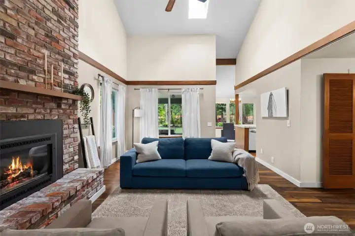 The spacious great room features a stunning floor-to-ceiling stone fireplace that perfectly balances modern elegance with cozy Northwest charm. The spacious great room features a stunning floor-to-ceiling stone fireplace that perfectly balances modern elegance with cozy Northwest charm.