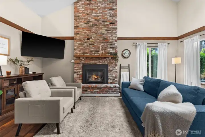 The ultimate showstopper! The great room centers around a magnificent, floor-to-ceiling stone fireplace, adding incredible architectural character, warmth, and a touch of luxury to the open-concept living space. The ultimate showstopper! The great room centers around a magnificent, floor-to-ceiling stone fireplace, adding incredible architectural character, warmth, and a touch of luxury to the open-concept living space.