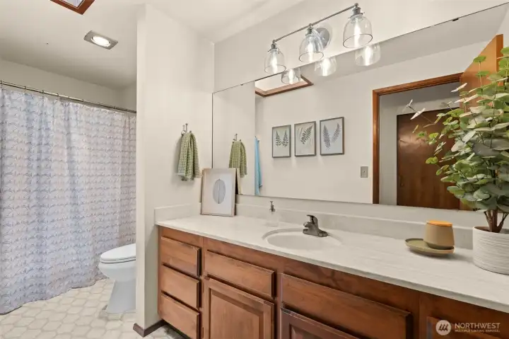 Convenience at every turn. This crisp, clean shared bathroom rounds out the home's thoughtful layout, offering a perfect blend of style and daily utility. Convenience at every turn. This crisp, clean shared bathroom rounds out the home's thoughtful layout, offering a perfect blend of style and daily utility.