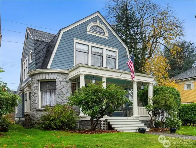 Gorgeous Victorian sits high up on large sunny lot!