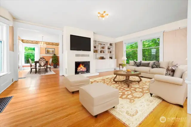 Virtually staged living room leading to dining room