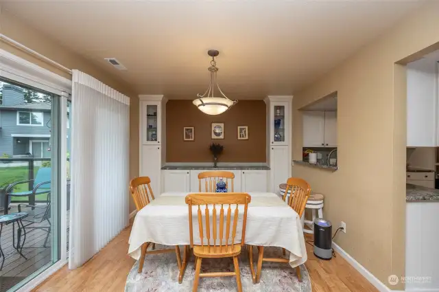dining with built cabinets and granite counters for your convenience