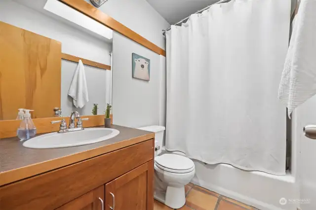 A skylight makes the guest bathroom nice and bright