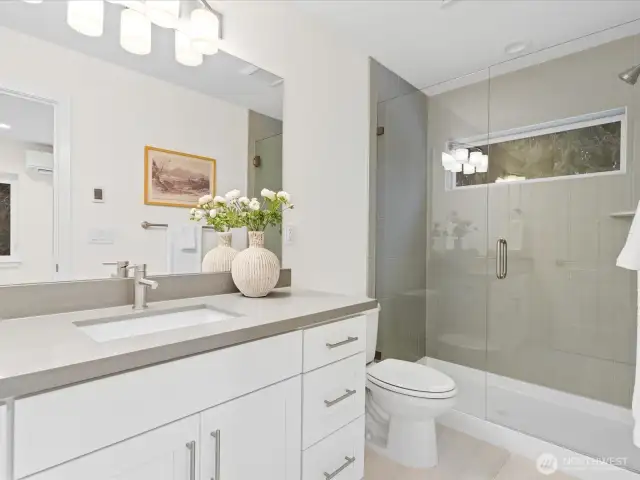 Custom tile and radiant floor heating in both upstairs bathrooms.