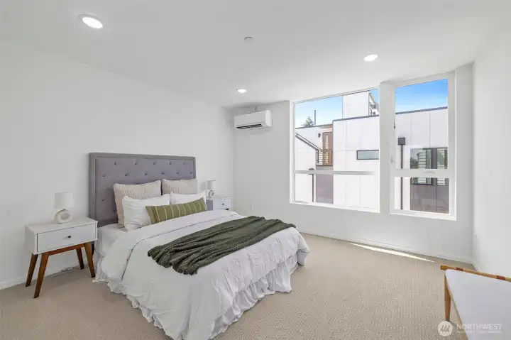 Spacious primary bedroom with ensuite bathroom! Model unit, finishes may vary.
