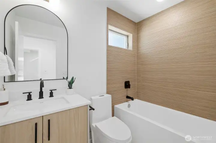 Lower level full bath. Model unit, finishes may vary.