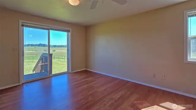 Primary Bedroom with steps to fenced back Yard