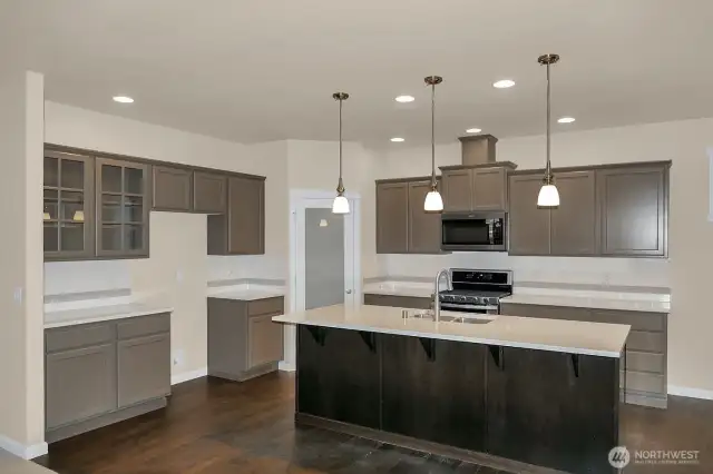 Home is under construction.  Photos are of a previously bult home in a different community with similar finishes.  Builder reserves the right to make changes to plans & specifications without notice.  Features vary by plan.  Buyer to verify square footage.