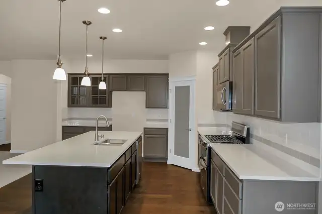 Home is under construction.  Photos are of a previously bult home in a different community with similar finishes.  Builder reserves the right to make changes to plans & specifications without notice.  Features vary by plan.  Buyer to verify square footage.