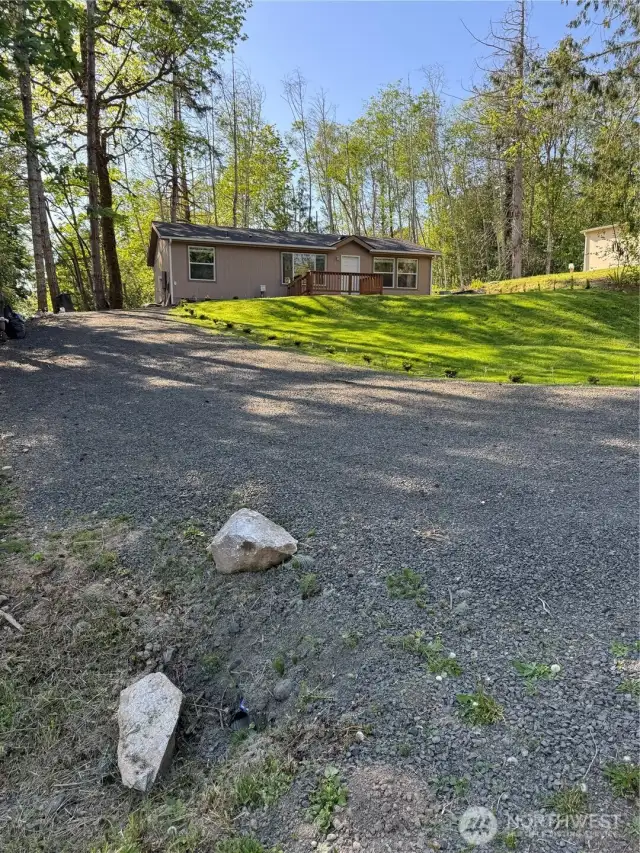 Spacious driveway can accommodate an RV, a boat and/or multiple cars.
