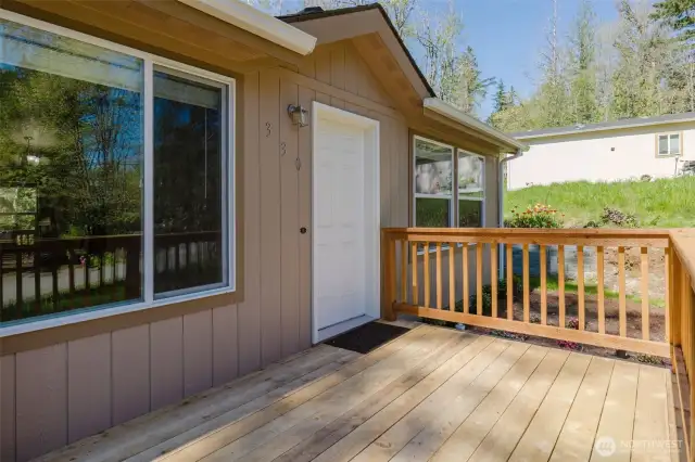 Treated wood deck front and back.