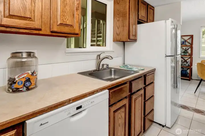Kitchen window looks out to your carport.