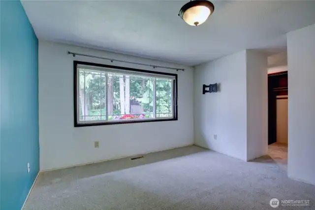 Additional view of primary bedroom looking toward closet and bathroom