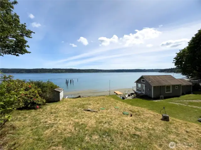 Welcome to this buildable waterfront lot on the Puget Sound in Gig Harbor, Washington. This lot is 48' of saltwater access and comes with an established bulkhead, in-place three bedroom septic system, and water and electricity on the property. Sellers have completed the wetland process, and permits have been started. If you aren't ready to build, newly installed stairs bring you right to the flat part of the lot for summer fun.