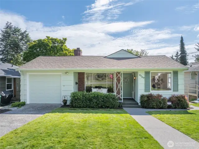 Front view of 1940 Classic Wedgwood home has covered porch & entry.