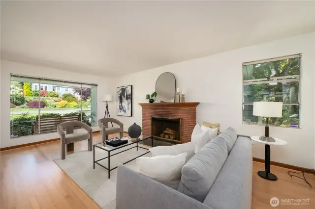 Living room has brick wood burning fireplace.