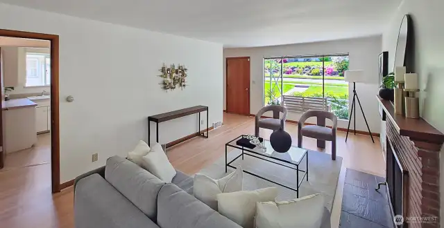 Living room looking to main entry and covered front porch.