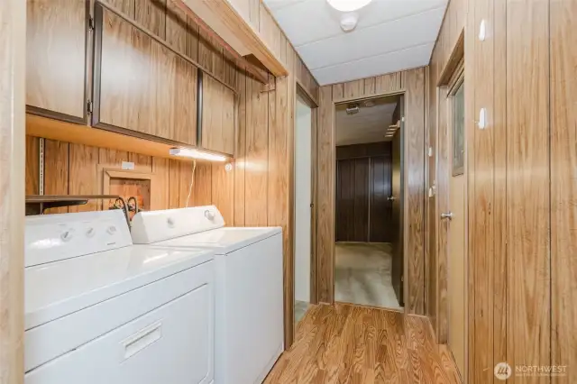 Convenient laundry located in the hallway near the bedrooms and bath.  More storage above the washer and dryer, which are included.