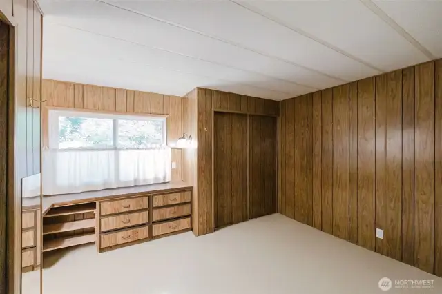 Another view of the Primary, showing the built-in dresser and the second double closet.