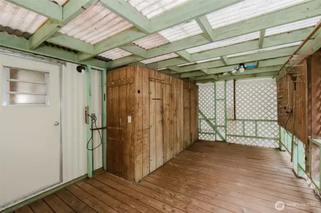 This is the covered back deck with more built-in storage closets.