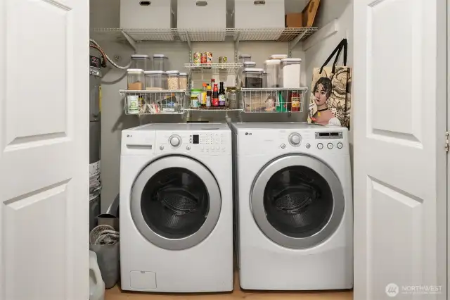 Convenient laundry in unit and space for added pantry storage.