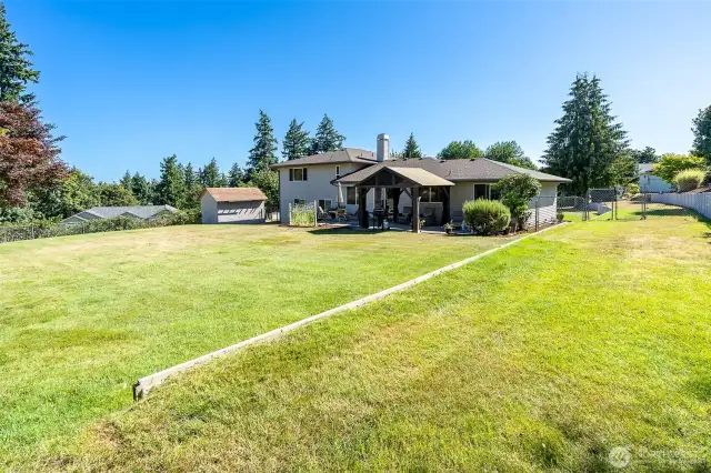 WOW, a Shy half Acre Homesite offer room for play and entertaining