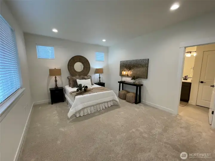 Another look at the primary bedroom and peek-a-boo look at the ensuite bathroom.