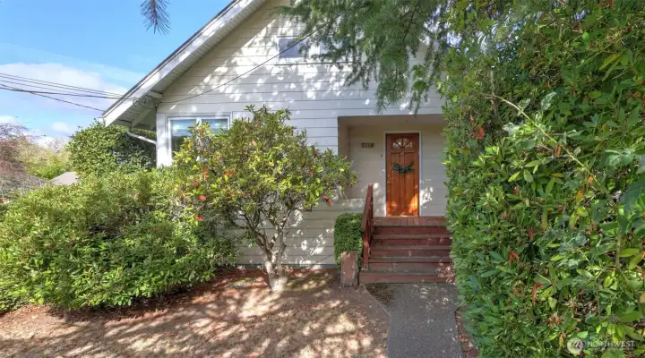 Discover the charm of Seward Park and Columbia City living in this spacious, light-filled home with flexible spaces and strong investment potential. The main home offers two bedrooms with a shared Jack & Jill bath, a bonus den/office, and a basement. The ADU adds a private 1-bed, 1-bath retreat—perfect for guests, rental income, or multi-generational living. Enjoy well-maintained hardwood floors in the living and dining room and new vinyl plank flooring in the bedrooms! You will love the large detached garage and partially fenced yard with ample space to run and play while the covered front porch provides year-round enjoyment. Minutes to Lake Washington, Seward Park trails, and easy I-5/I-90 access.