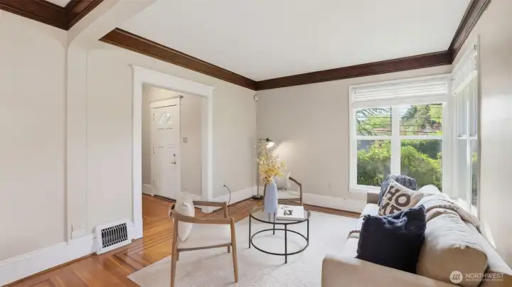 An airy living room filled with warmth, natural light, and timeless character.