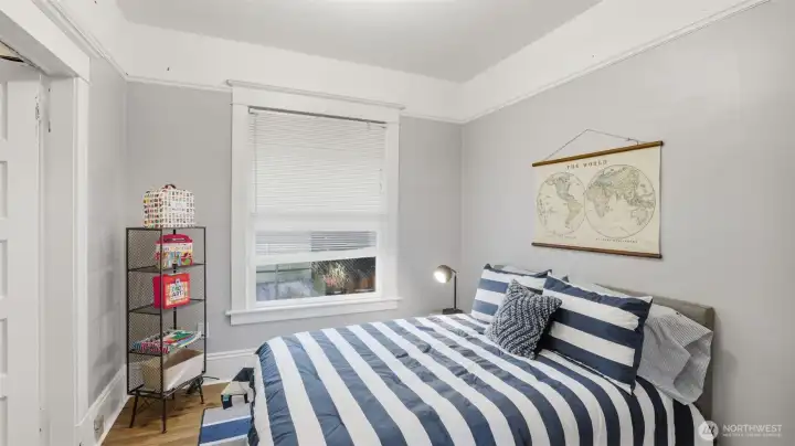 A cozy bedroom retreat with soft natural light for rest and relaxation.