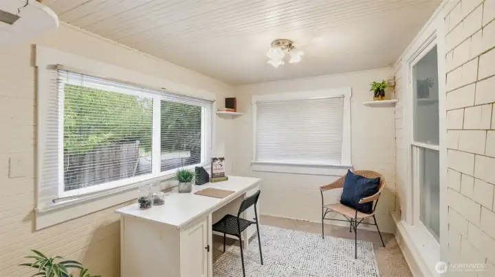 This sunlit flex space makes an inspiring home office or creative studio.