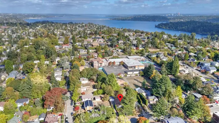 Bird’s-eye perspective highlighting proximity to schools, parks, and the lake, with the city skyline just minutes away.