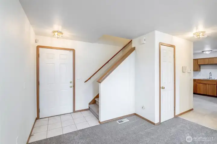 Front entry and stairs to upper floor