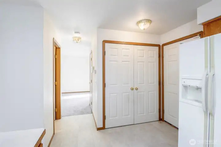 Doors to utility space and hall to powder bath