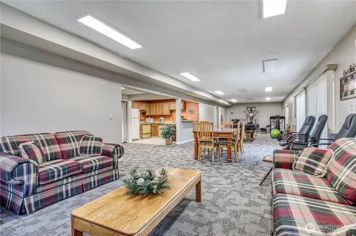 Clubhouse with kitchen, gathering spot, workout area, locker rooms and saunas