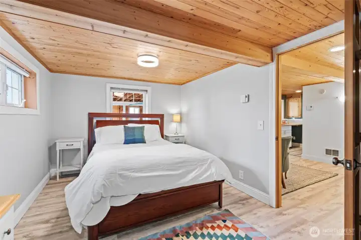 Downstairs bedroom opens into bonus room/office space equipped with new LVL flooring, 3/4 bath, utility sink and carport entrance.