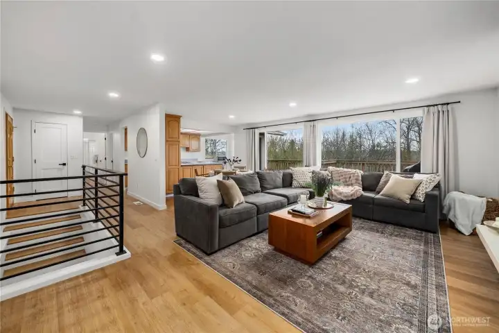 Updated Custom metal railings really set off the new wide plank LVP flooring in the main living areas and on the stairs.